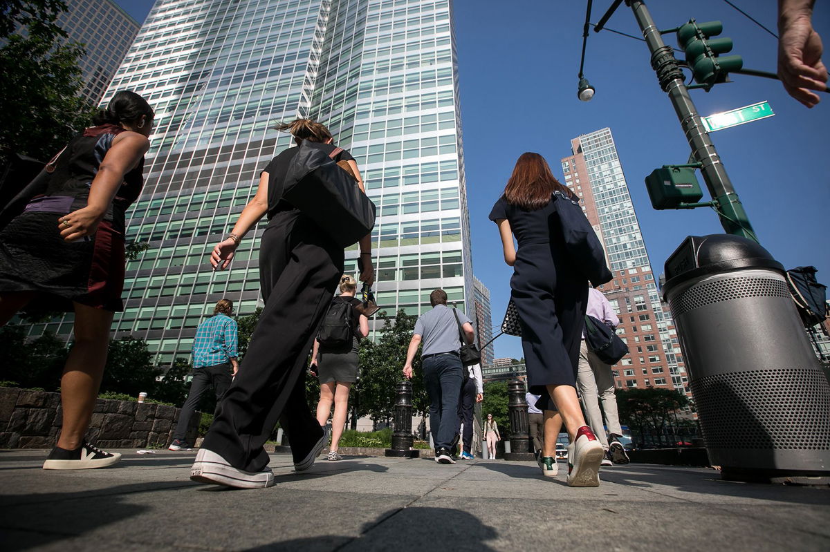 <i>Michael Nagle/Bloomberg/Getty Images</i><br/>Pedestrians walk towards Goldman Sachs headquarters in New York