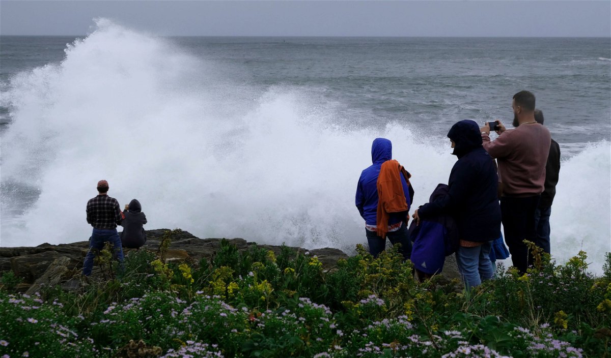 <i>Jim Gerberich/AP</i><br/>People watch rough surf and waves