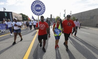 United Auto Workers members march in the Detroit Labor Day Parade on September 4 in Detroit