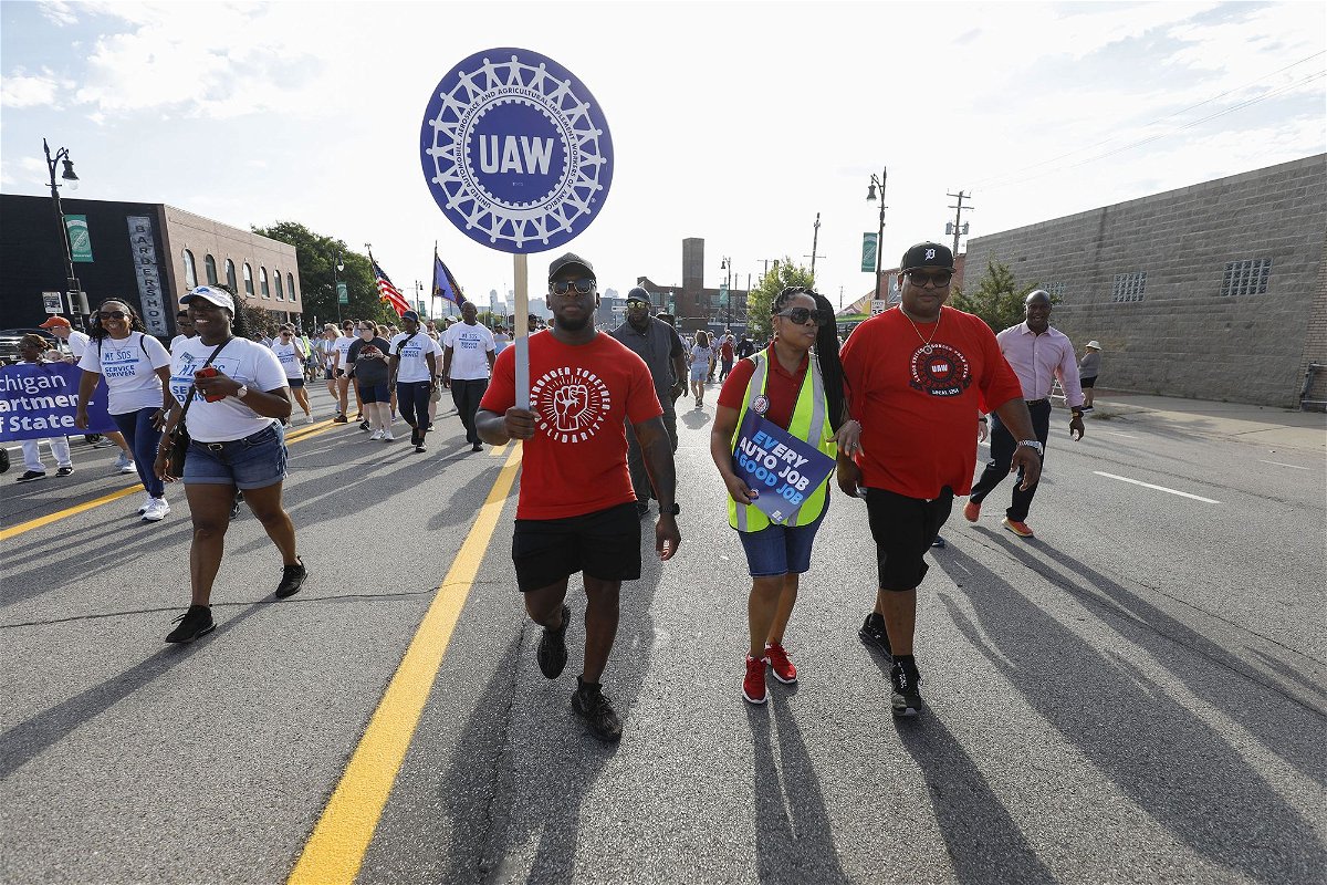 <i>Bill Pugliano/Getty Images</i><br/>United Auto Workers members march in the Detroit Labor Day Parade on September 4 in Detroit