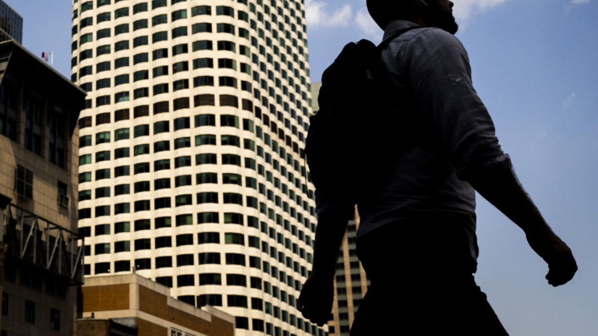 <i>Adam Glanzman/Bloomberg/Getty Images</i><br/>A pedestrian walks by South Station in downtown Boston