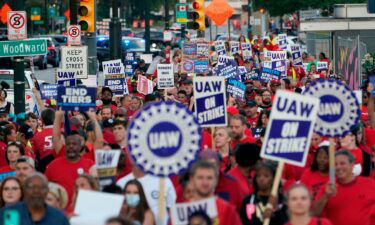 United Auto Workers members march through downtown Detroit