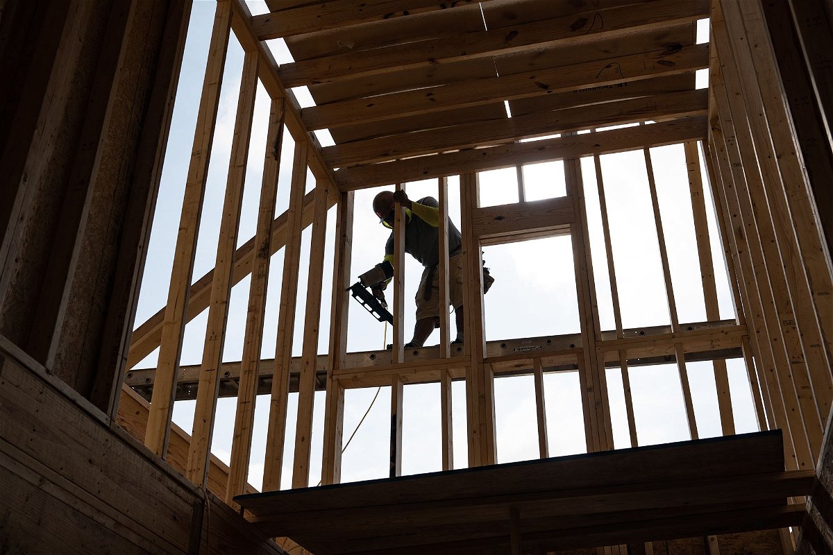 <i>Allison Joyce/Bloomberg/Getty Images</i><br/>A worker builds a home in Lillington