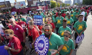United Auto Workers members walk in the Labor Day parade in Detroit on Sept. 4. Time is running out to avert a strike that could shut down America’s unionized auto assembly plants and other manufacturing facilities.