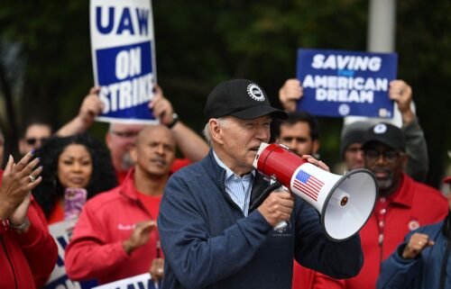 US President Joe Biden addresses striking members of the United Auto Workers (UAW) union at a picket line outside a General Motors Service Parts Operations plant in Belleville