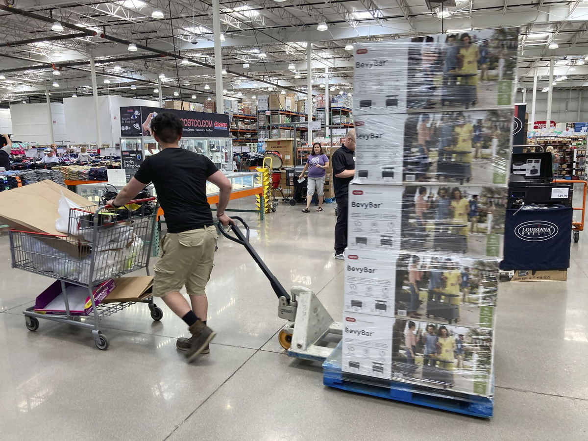 <i>David Zalubowski/AP</i><br/>A worker guides a pallet of goods to a display spot in a Costco warehouse on July 8