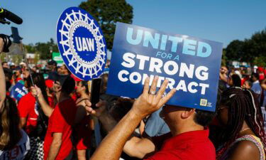 United Auto Workers members and others gather for a rally after marching in the Detroit Labor Day Parade on September 4 in Detroit
