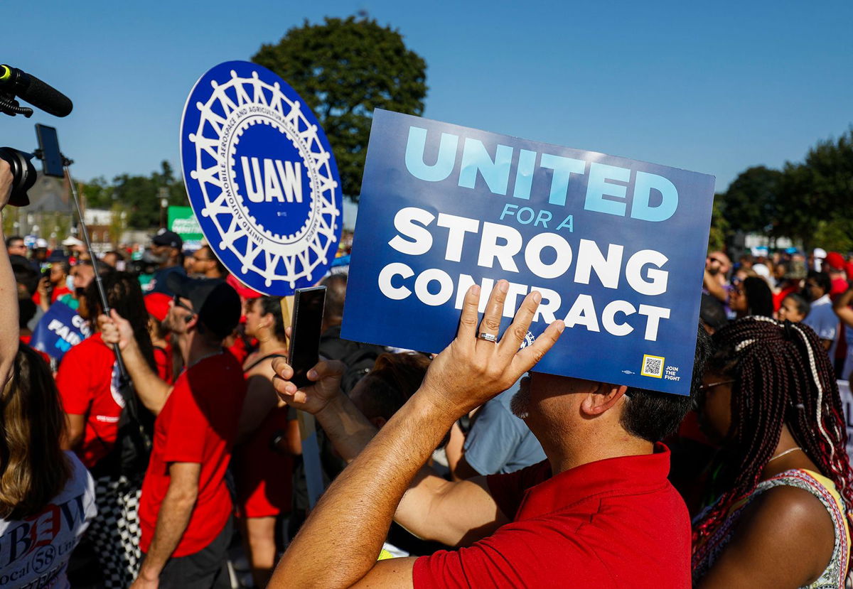 <i>Bill Pugliano/Getty Images</i><br/>United Auto Workers members and others gather for a rally after marching in the Detroit Labor Day Parade on September 4 in Detroit