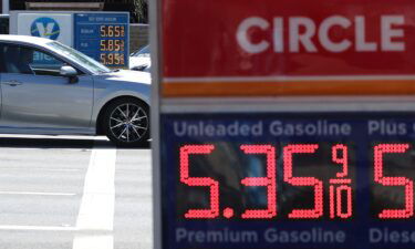 Gas prices over $5.00 a gallon are displayed at a gas station on September 13