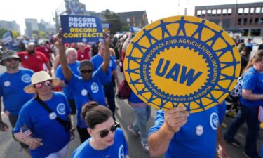 United Auto Workers members walk in the Labor Day parade in Detroit