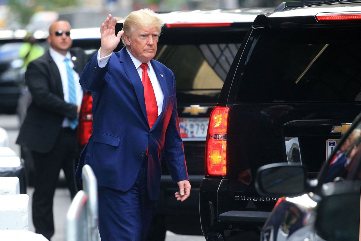 <i>Stringer/AFP/Getty Images</i><br/>Former US President Donald Trump waves while walking to a vehicle outside of Trump Tower in New York City on August 10