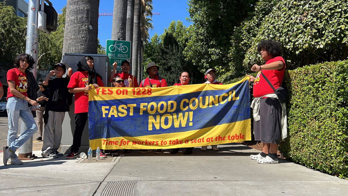 <i>Terry Chea/AP</i><br/>Fast food workers and union activists demonstrate outside the California State Capitol in support of legislation to increase fast-food worker wages to $20 an hour