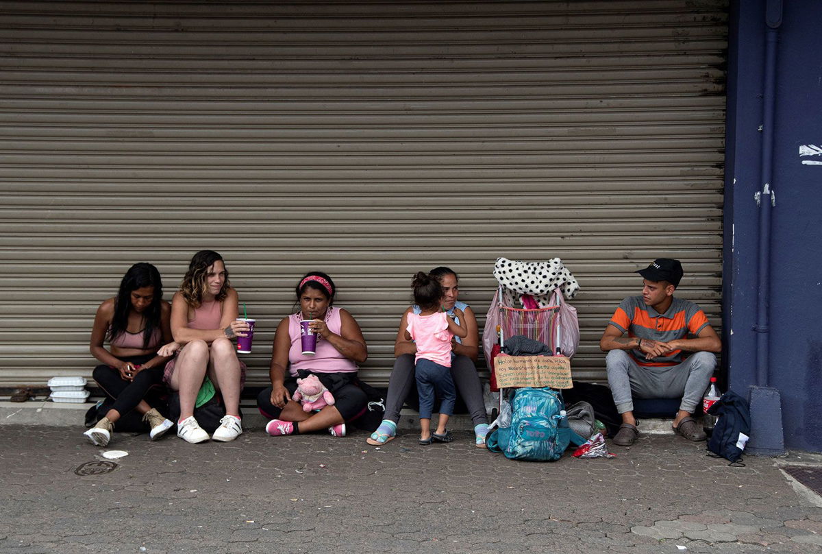 <i>Ezequiel Becerra/AFP/Getty Images/FILE</i><br/>A group of Venezuelan migrants ask for money to continue their journey to the United States in San Jose