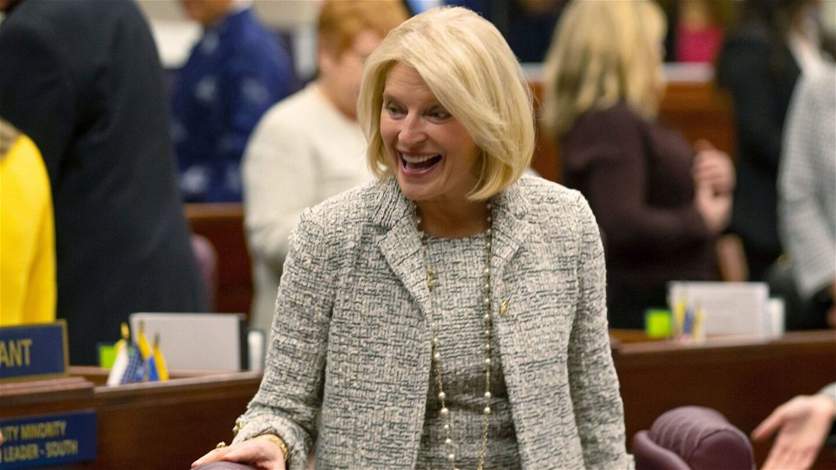 <i>Tom R. Smedes/AP</i><br/>Nevada Republican Assemblywoman Heidi Kasama laughs with lawmakers in Carson City