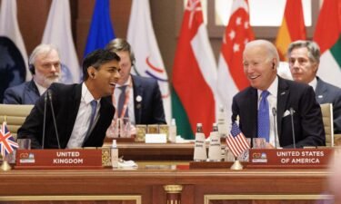 British Prime Minister Rishi Sunak laughs with US President Joe Biden during the G20 Leaders' Summit on September 9 in New Delhi