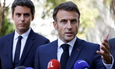 French President Emmanuel Macron gestures as he addresses the audience next to French Education and Youth Minister Gabriel Attal on September 1.