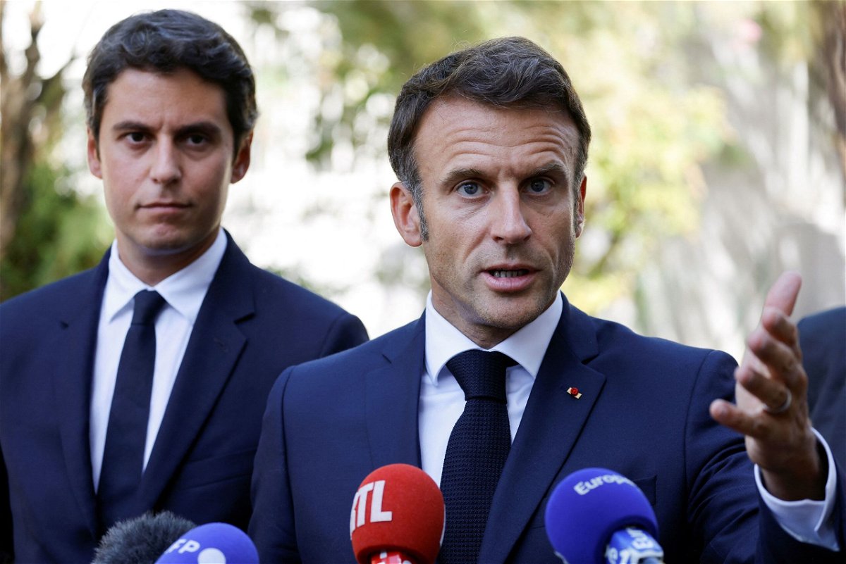 <i>Ludovic Marin/Pool/Reuters</i><br/>French President Emmanuel Macron gestures as he addresses the audience next to French Education and Youth Minister Gabriel Attal on September 1.
