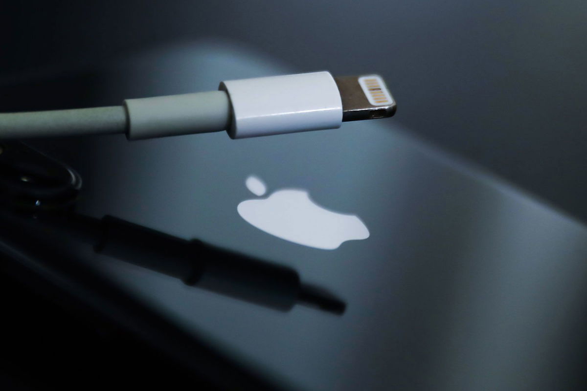 <i>Jakub Porzycki/NurPhoto/Getty Images/FILE</i><br/>Lightning cable and Apple logo on iPhone are seen in this illustration photo taken in Krakow