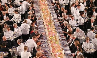 Waiters serve dessert during the Nobel Prize banquet on December 10