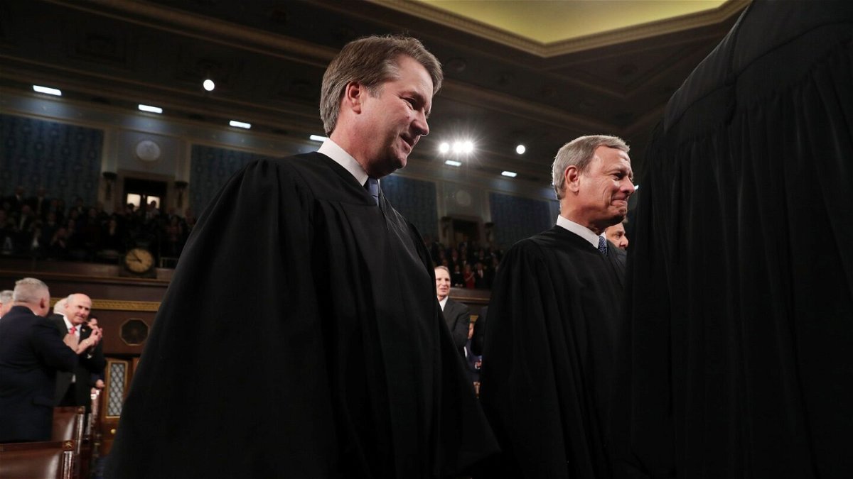 <i>Leah Millis/Pool/Getty Images</i><br/>Supreme Court Justice Brett Kavanaugh and Chief Justice John Roberts joined the court's three liberals to reject Alabama's proposed congressional map.