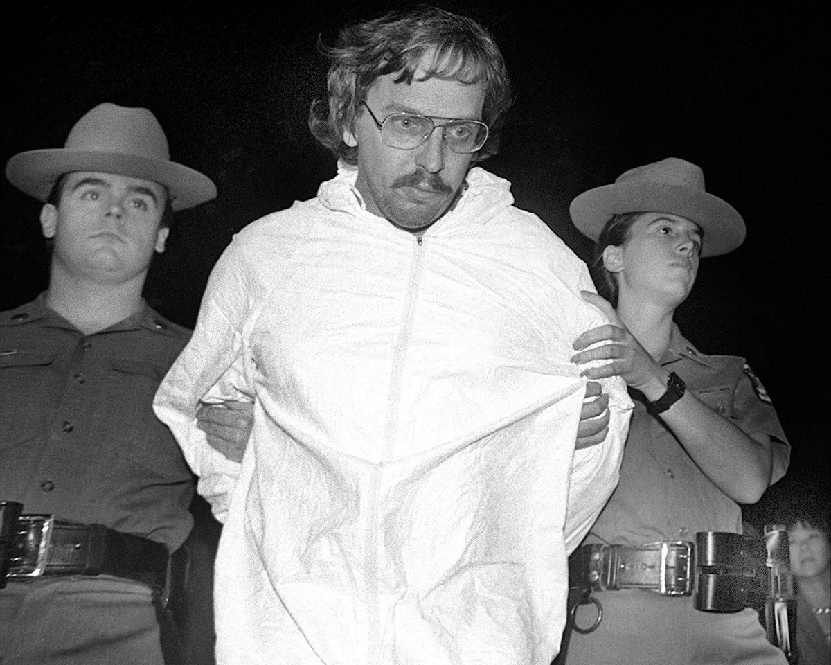 <i>Andrew Savulich/NY Daily News Archive/Getty Images</i><br/>New York State Police Sean Ruane and Deborah Spaargaren escort Joel Rifkin