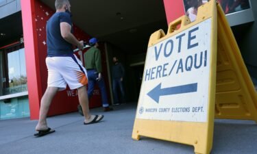 Voters arrive to cast their ballots at the Phoenix Art Museum on November 8