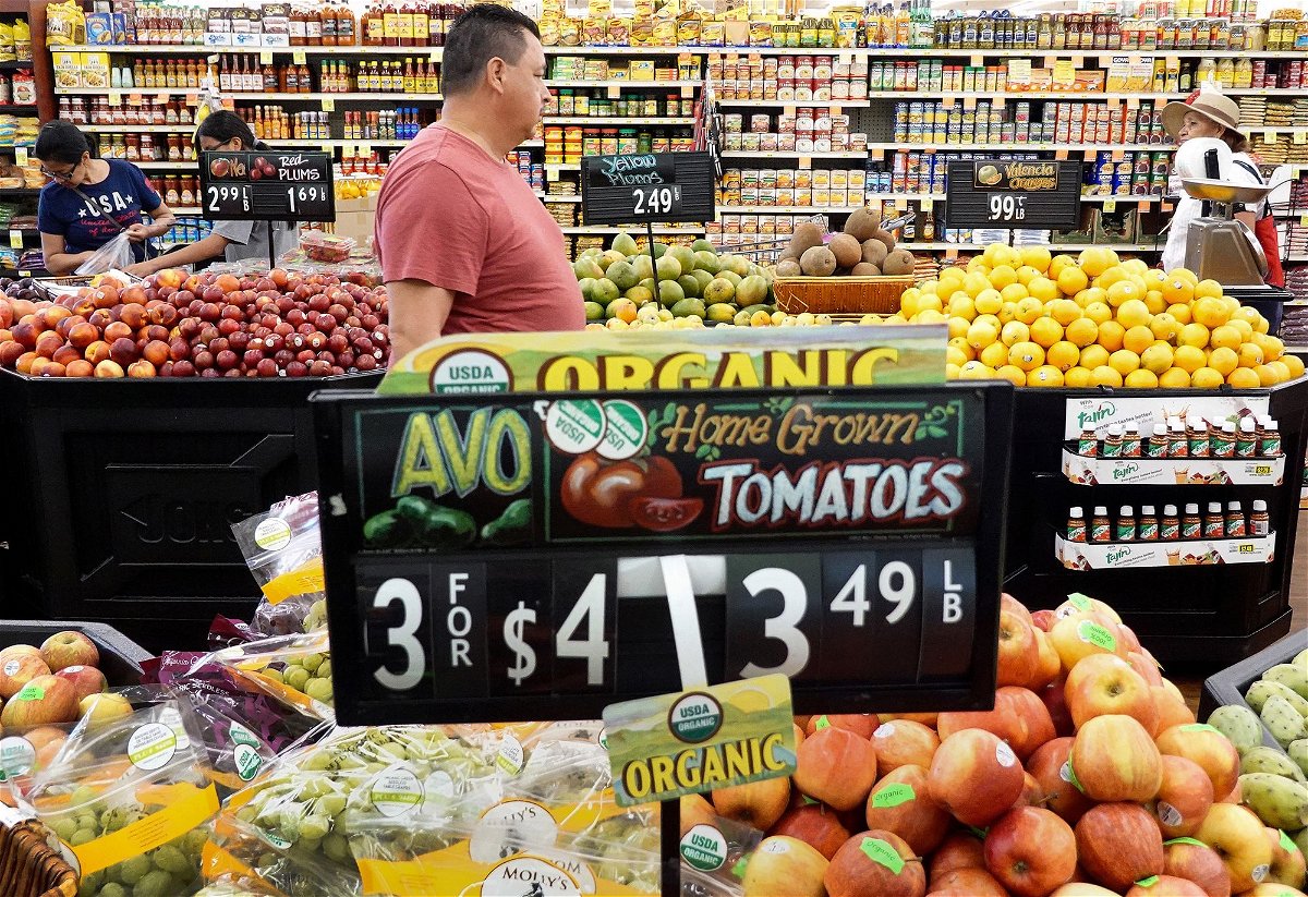 <i>Mario Tama/Getty Images</i><br/>People shop in the produce section of a grocery store on September 12 in Los Angeles
