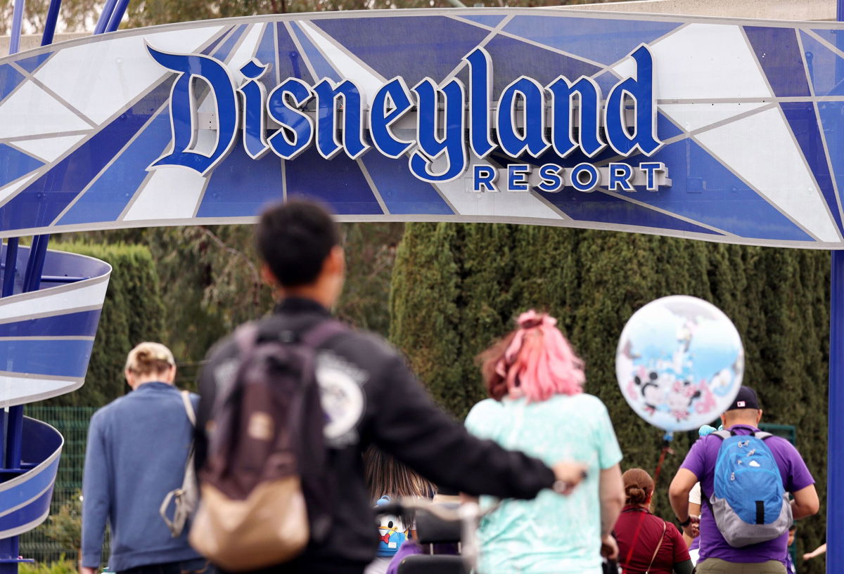 <i>Mario Tama/Getty Images</i><br/>People are seen here entering Disneyland in Anaheim