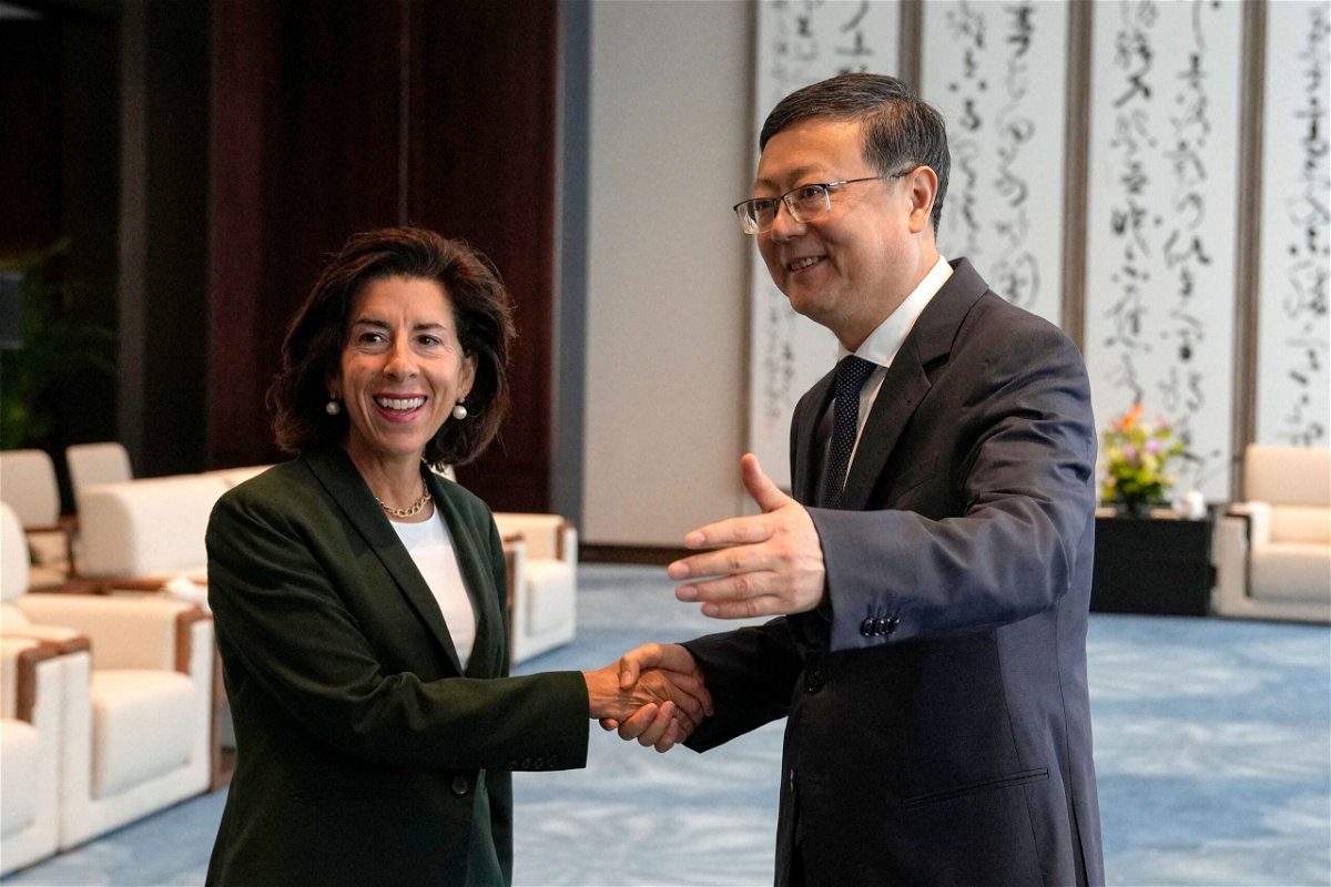 <i>Andy Wong/Pool/Getty Images</i><br/>Shanghai Party Secretary Chen Jining (right) gestures as he shakes hands with US Commerce Secretary Gina Raimondo before a meeting in Shanghai on August 30.
