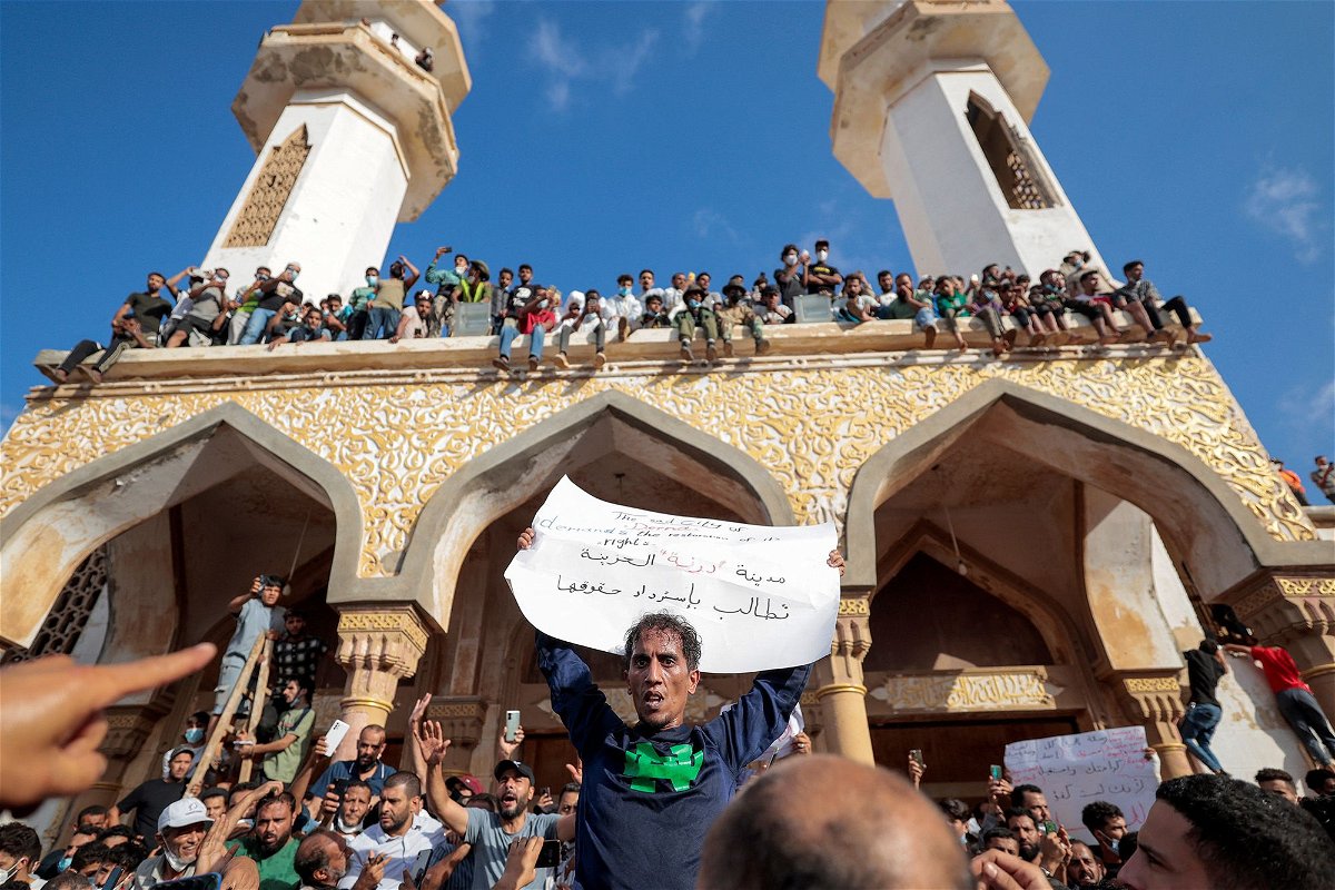 <i>Zohra Bensemra/Reuters</i><br/>People who survived the deadly floods protest outside the Sahaba Mosque in Derna on September 18.
