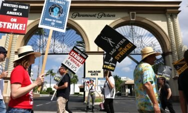 WGA members picket with striking SAG-AFTRA members outside Paramount Studios in September.