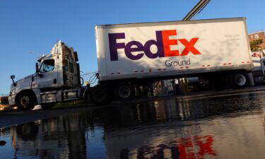 A FedEx delivery truck exits a facility in Brooklyn