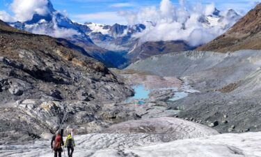 Glaciologists climb over the collapsed tongue of the Findel Glacier (Valais). The radiantly blue glacial lakes were still covered by dozens of metres of ice a decade ago.