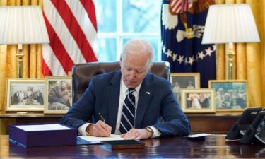 US President Joe Biden signs the American Rescue Plan in March 2021