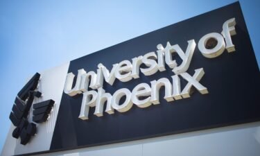 A sign marks the location of the University of Phoenix Chicago campus in July 2015 in Schaumburg