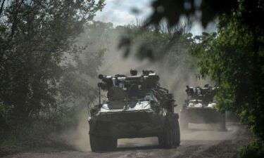 Ukrainian servicemen ride on armoured personnel carriers on a road toward Bakhmut on July 1. Fighters who had previously fought in Ukraine for the Russian mercenary group Wagner have returned to the battlefield in the east.
