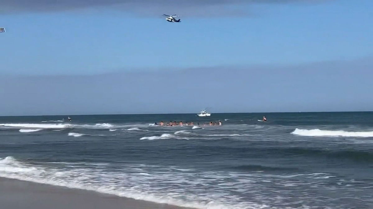 <i>WABC</i><br/>Lifeguards created a human chain during a rescue attempt to search for one victim that was submerged in Beach Haven
