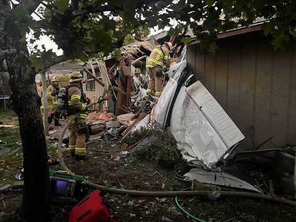 Authorities are investigating why a small plane crashed into the roof of a Newberg home, killing 2 of the plane's 3 occupants