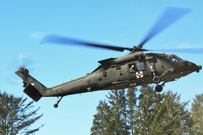 An Oregon Army National Guard UH-60 Black Hawk helicopter takes off from a landing zone during the Oregon Army National Guard's 2022 Best Warrior Competition, March 19, 2022 at Camp Rilea near Warrenton