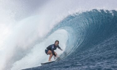 Marks surfs a wave at the SHISEIDO Tahiti Pro in August