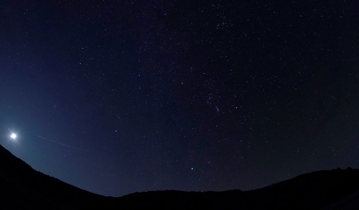 <i>George Frey/Reuters</i><br/>A meteor of the Orionid meteor shower streaks across the night sky above the San Rafael Swell outside Green River