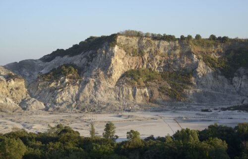 Solfatara is a shallow volcanic crater at Pozzuoli