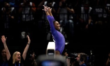 Simone Biles competes in the women's beam final at the world championships.