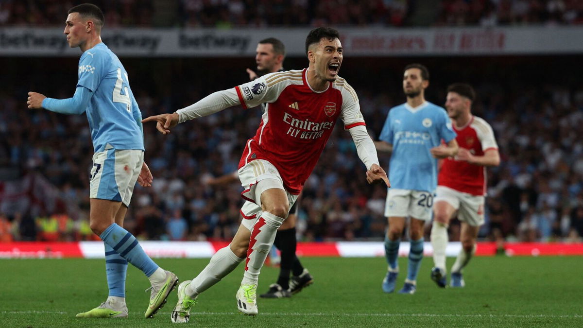 <i>Adrian Dennis/AFP via Getty Images</i><br/>Gabriel Martinelli celebrates after scoring against Manchester City.