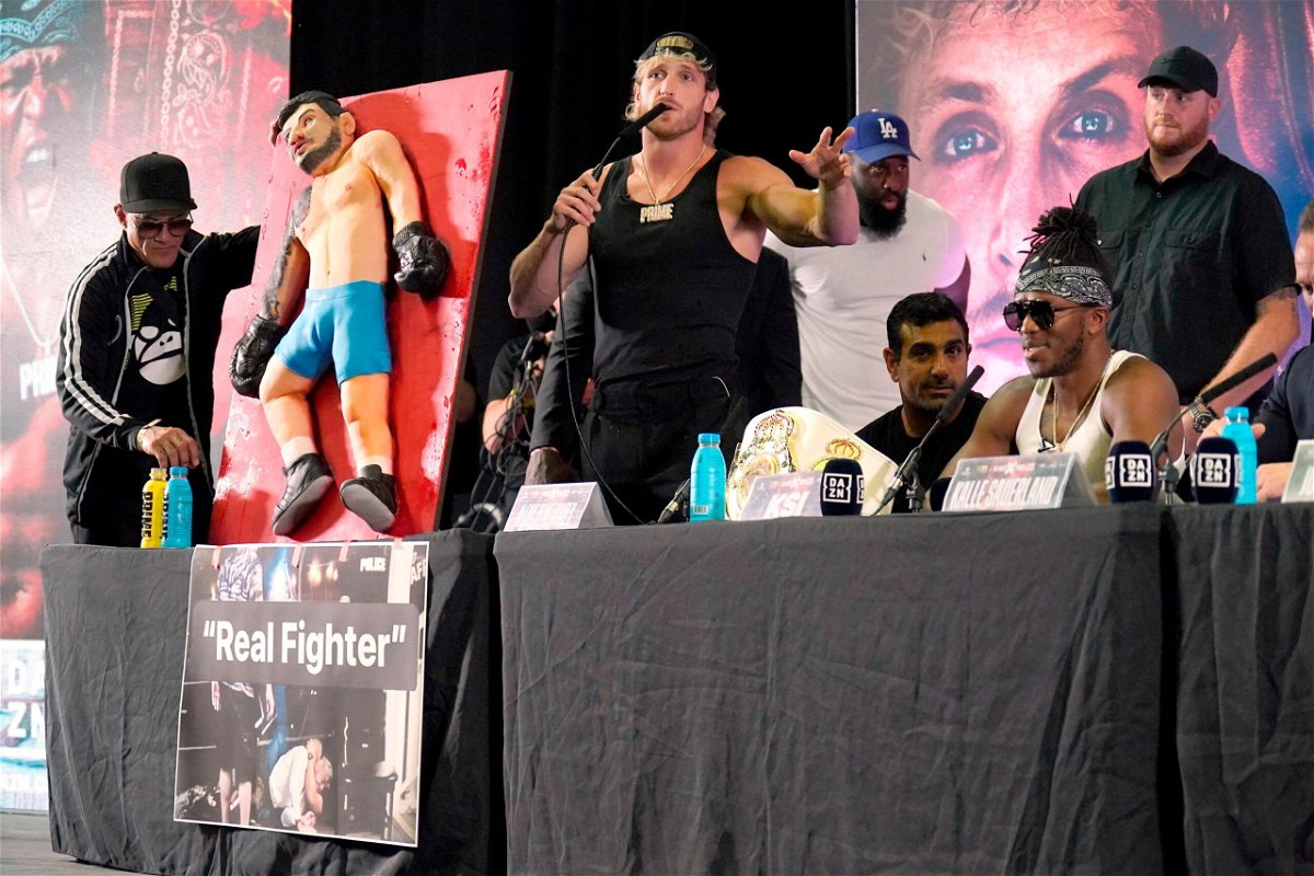 <i>Jonathan Brady/AP</i><br/>KSI and Tommy Fury go head-to-head during a press conference ahead of their fight on August 22.