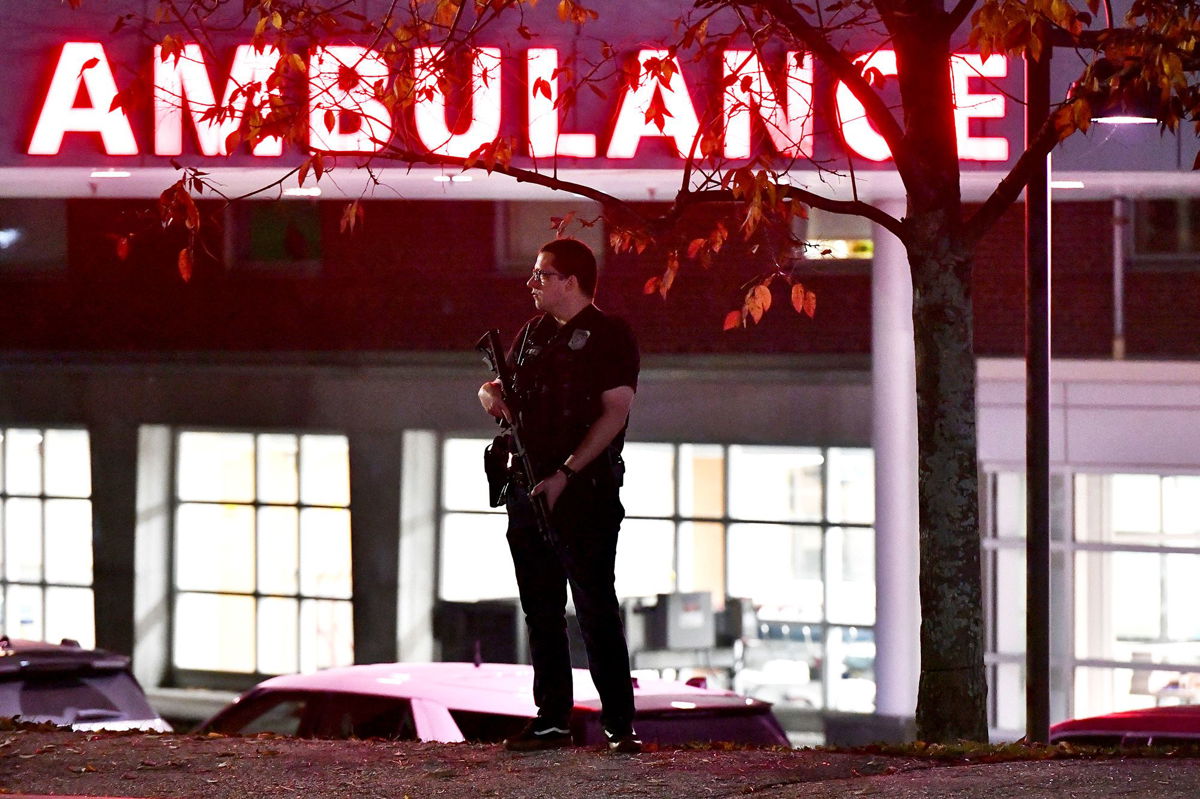 <i>Joseph Prezios/AFP/Getty Images</i><br/>An armed police officer guards the ambulance entrance to the Central Maine Medical Center in Lewiston