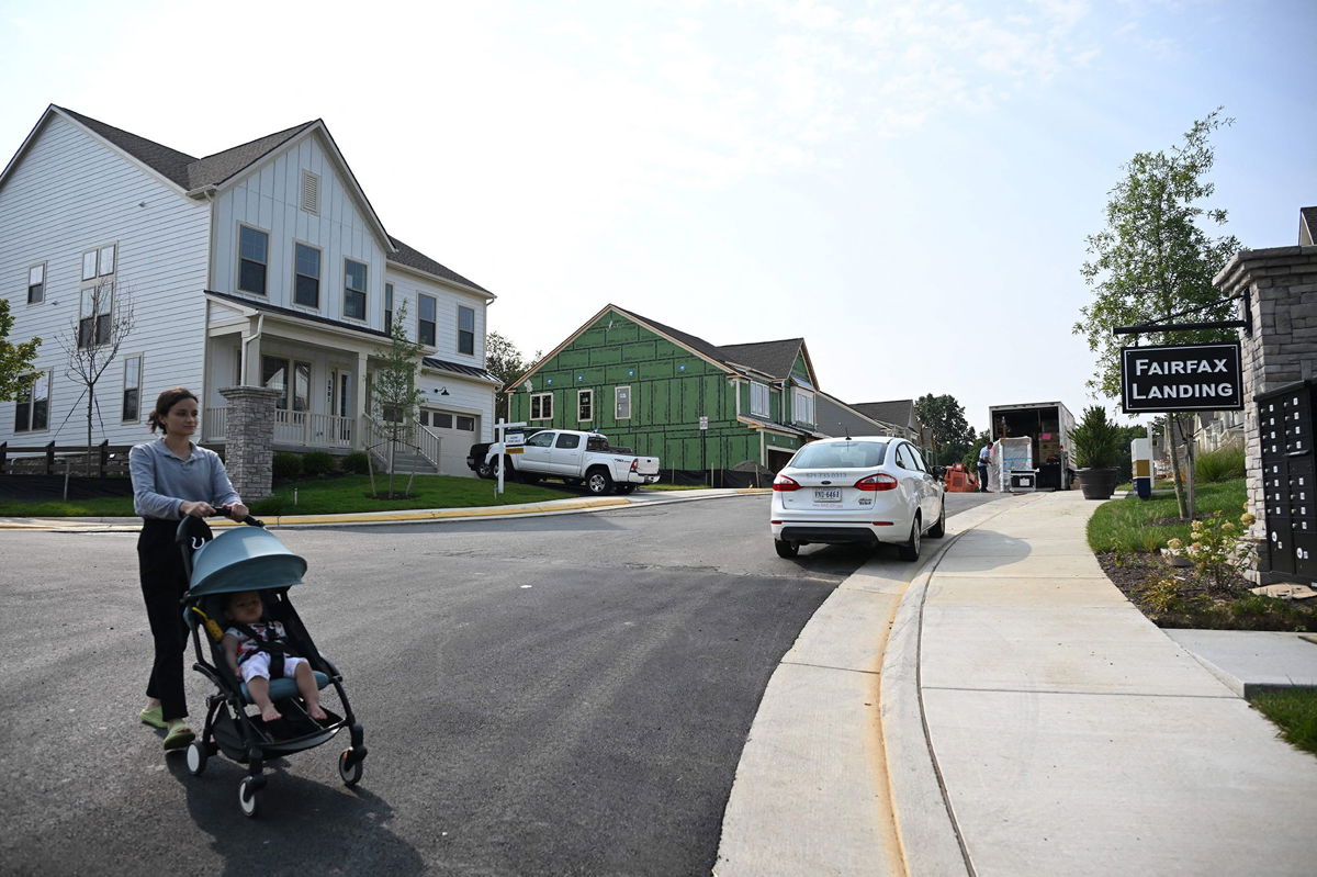 <i>Andrew Caballero-Reynolds/AFP/Getty Images</i><br/>A person pushes a child in a stroller in a new housing development in Fairfax