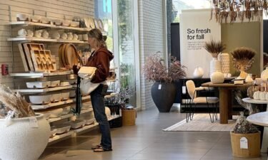 A customer shops at a Crate and Barrel store on October 17