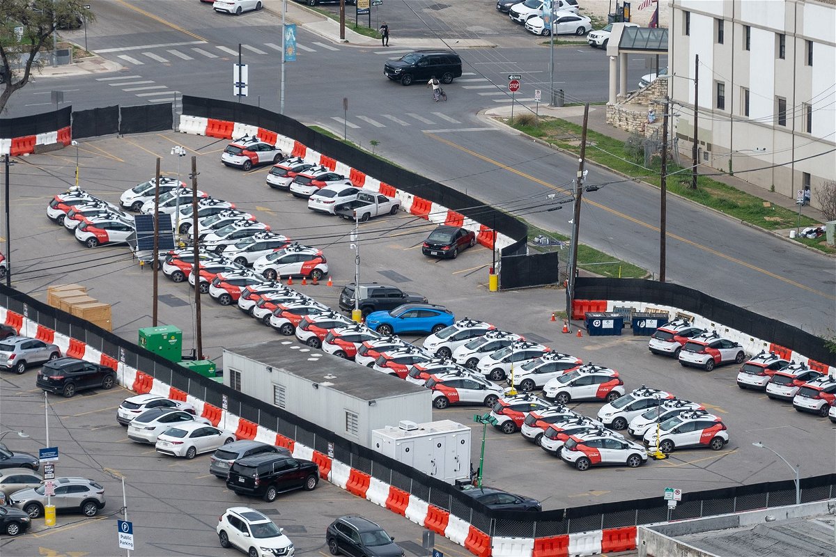 <i>Smith Collection/Gado/Getty Images</i><br/>Aerial view of a parking lot filled with multiple GM Cruise self-driving cars in Austin