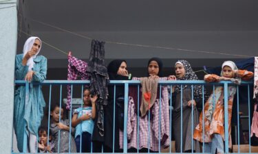 Palestinians carrying their belongings flee to safer areas in Gaza City after Israeli airstrikes on October 13